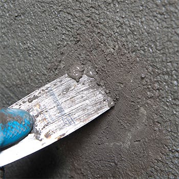 Remove excess material with trowel