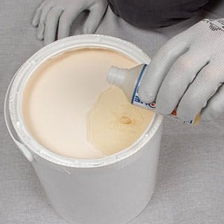 Pour specified amount of Dryzone ACS into paint
