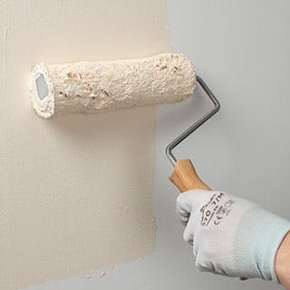 Apply paint to wall or ceiling